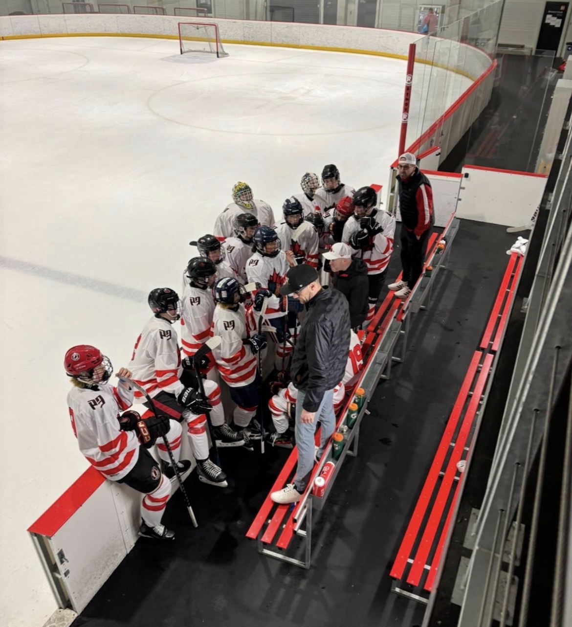 Team huddle at the bench